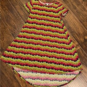 Short sleeve" Carly style" dress. Longer in front, shorter in back.